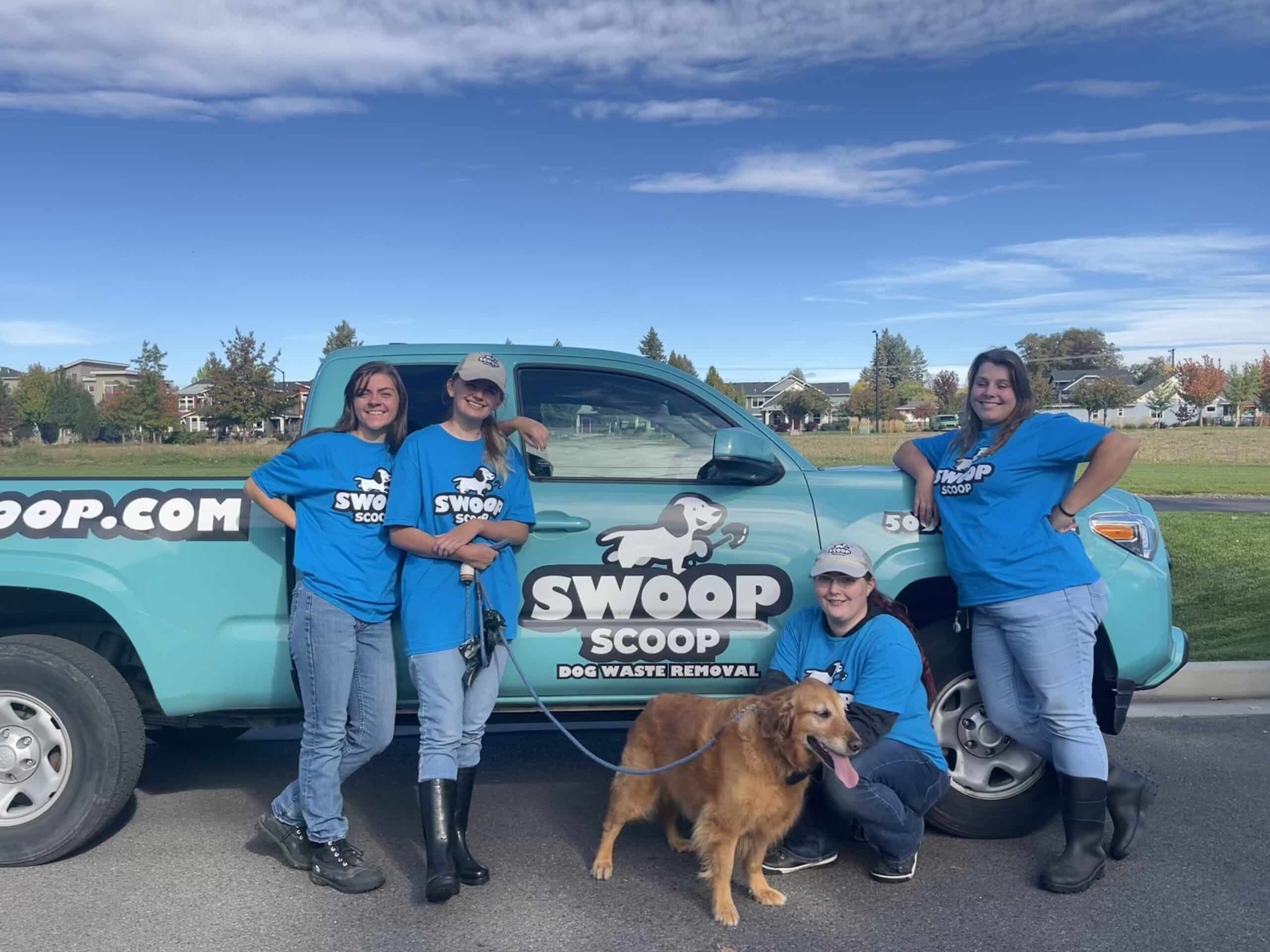 Dog waste removal team in Spokane, WA standing in front of a Swoop Scoop Truck.